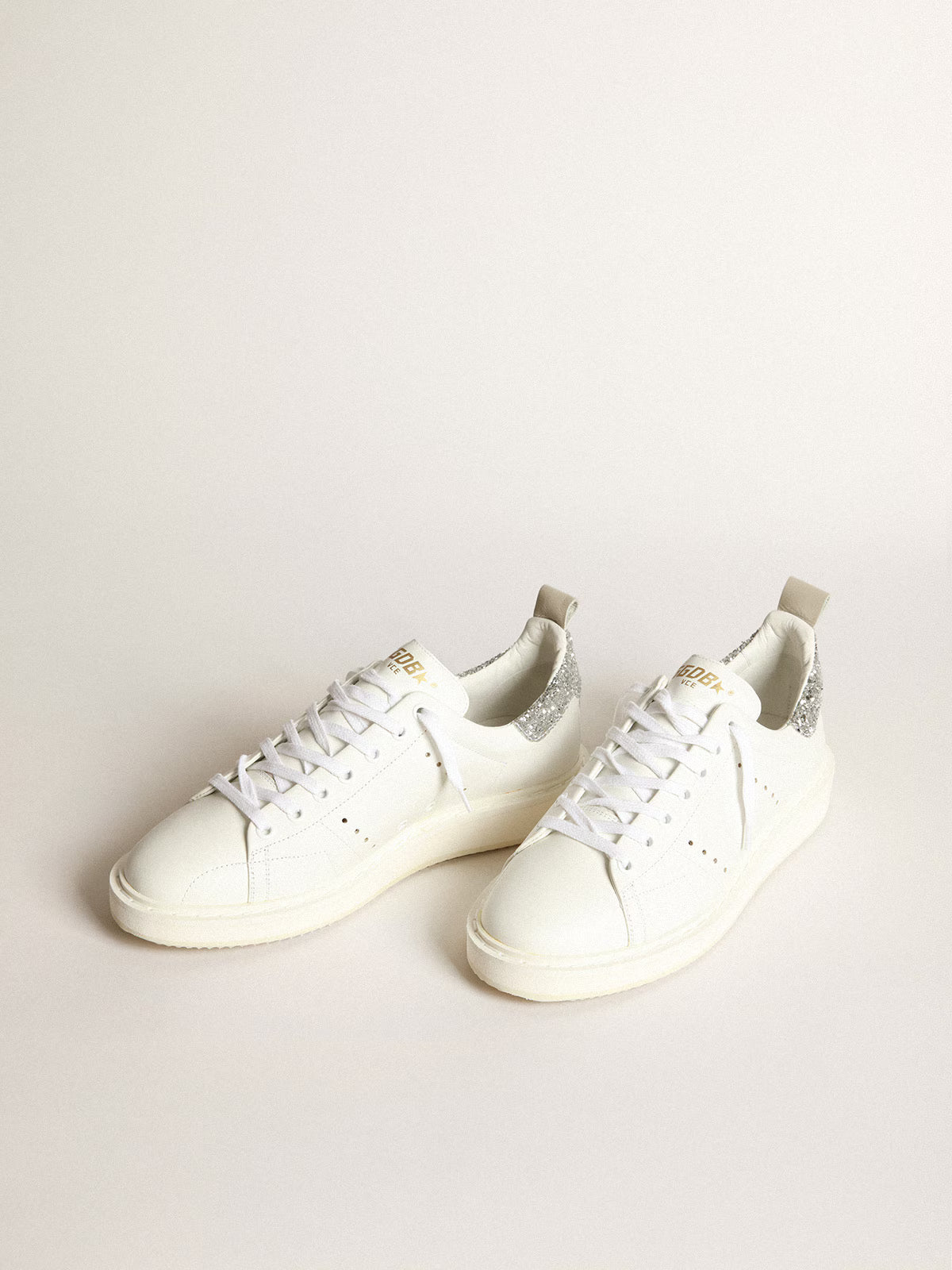 Starter donna in pelle bianca con talloncino glitter argento