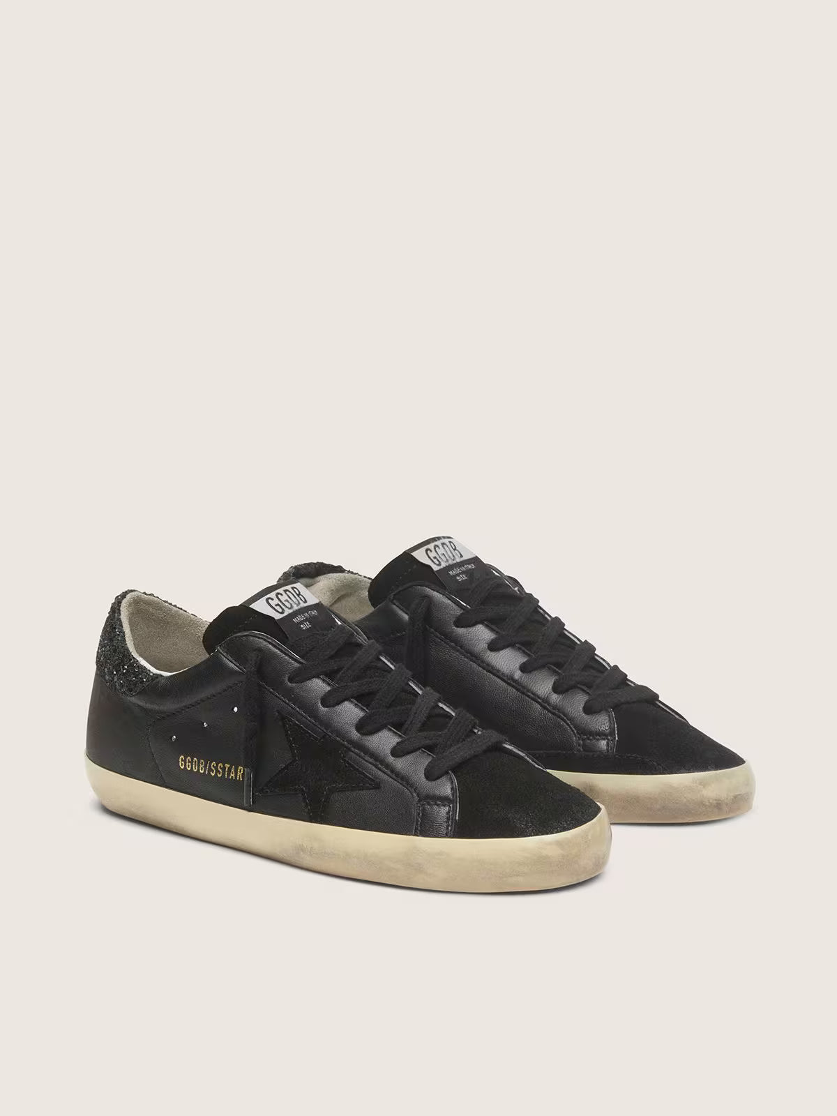 Golden Goose Super-Star Donna in nappa nera con stella in suede nero e talloncino in glitter neri