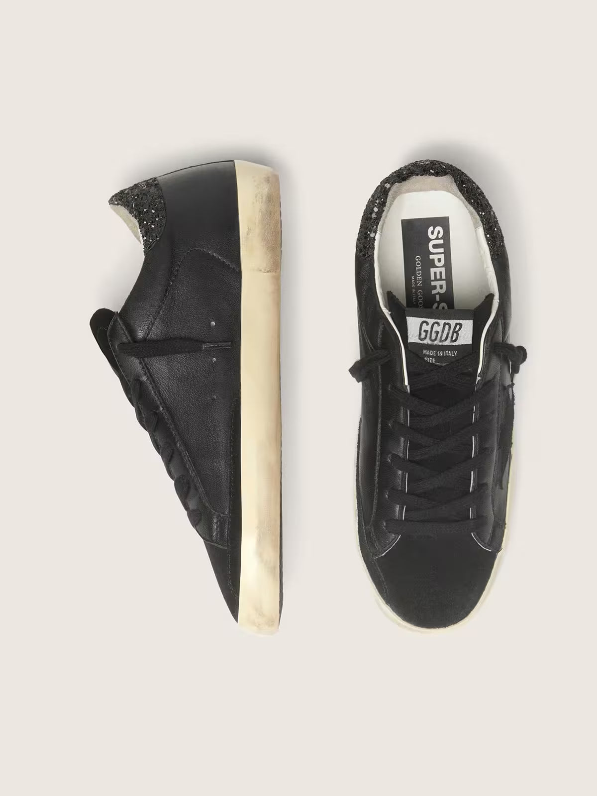 Golden Goose Super-Star Donna in nappa nera con stella in suede nero e talloncino in glitter neri