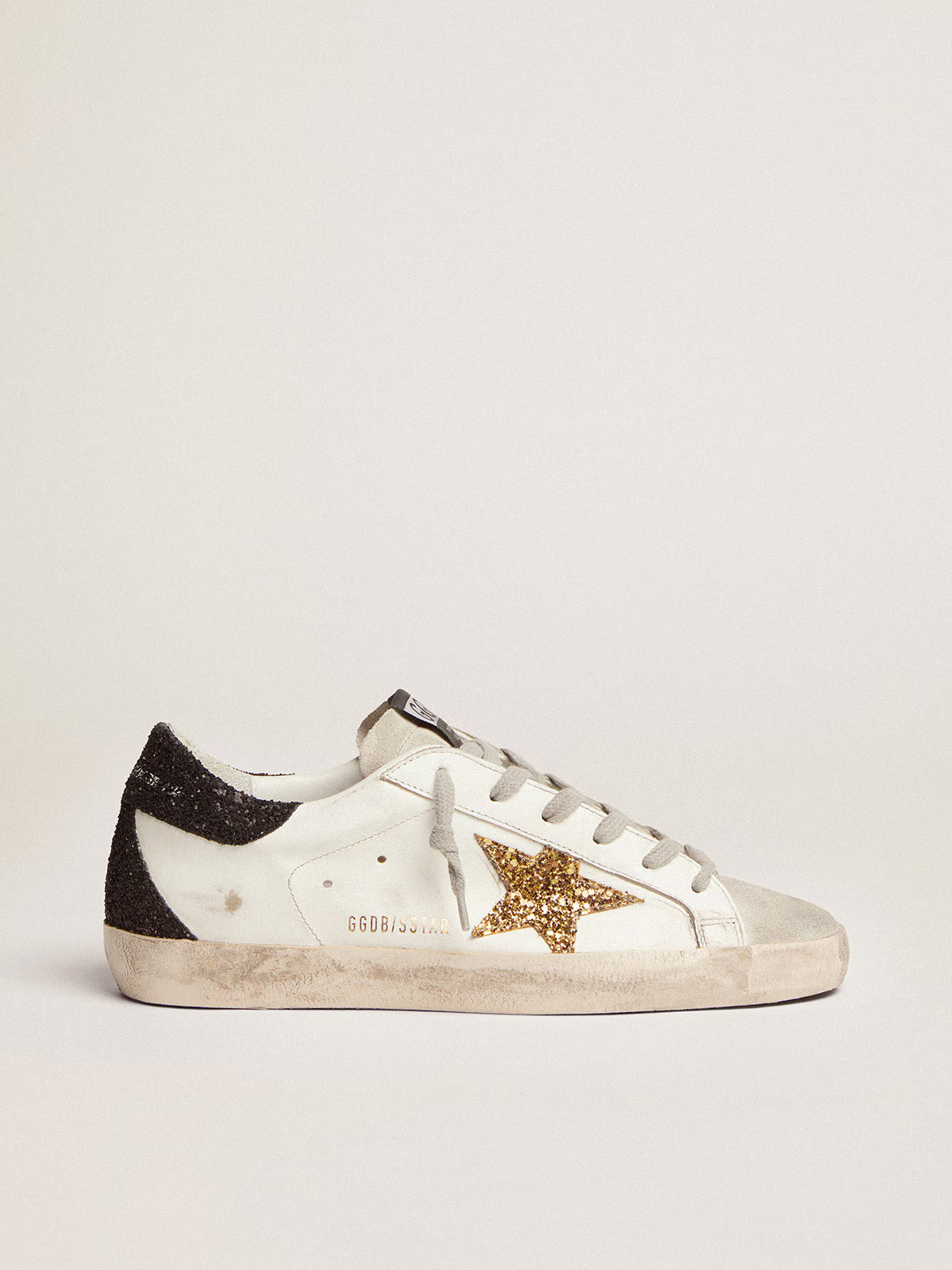Golden Goose Super-Star Donna in nappa con stella in glitter oro e talloncino in glitter nero
