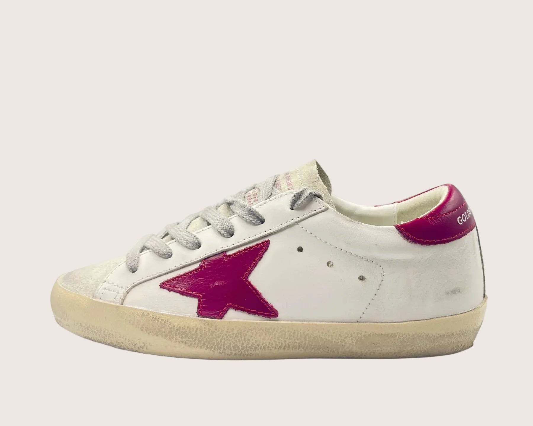 Golden Goose Super-Star Limited Edition in pelle bianca con stella magenta